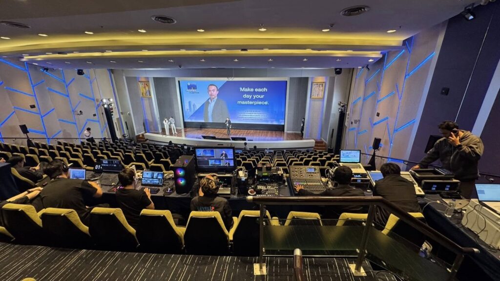 University professor live streaming a lecture to online students with presentation slides