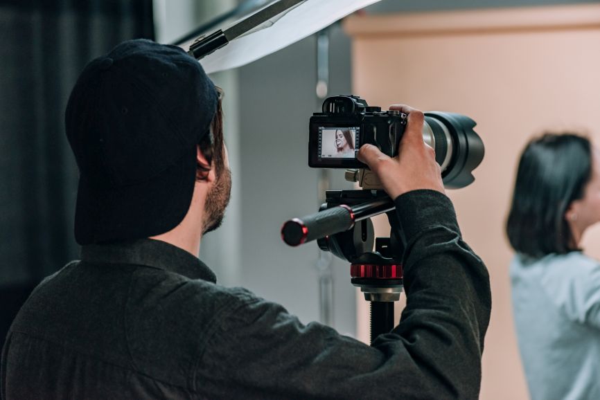 a production company thailand crew films a studio portrait session
