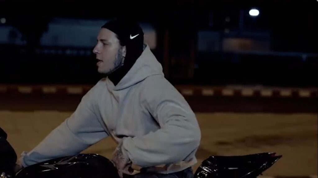 Tymek on a motorbike at night in the Papieroska music video, shot in Thailand by Scarlet Production