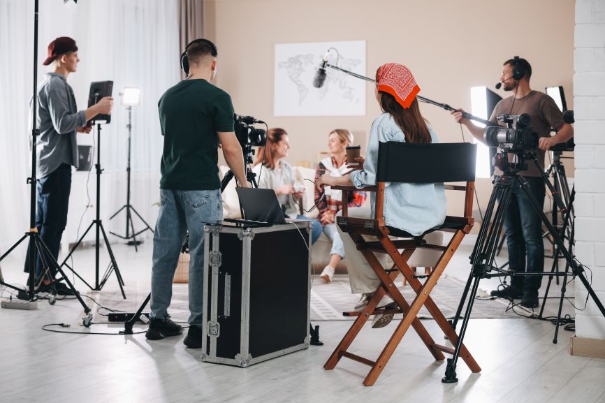 a music video director leads creative decisions while the producer coordinates filming logistics and crew